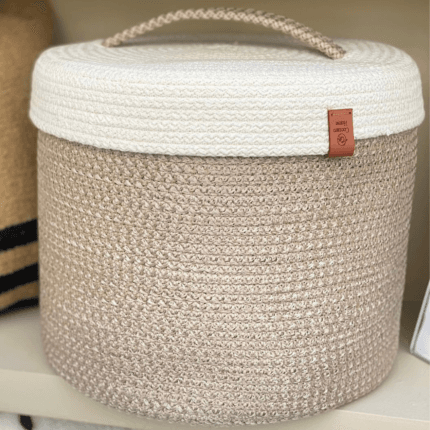 beige storage basket with off white cover