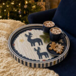 Navy Reindeer round tray in a styled home setting