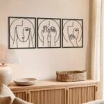 Abstract Faces Line Art Metal Wall Art in a living space