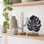Cactus & Monstera Metal Table Sculptures on Wooden Base in a living space