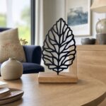 Leaf Vein Metal Table Sculpture on Wooden Base in a living space