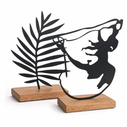 Palm Leaf & Face Silhouette Metal Table Sculptures on Wooden Base on a white background