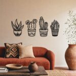 Potted Cactus Family Metal Wall Art in a living space
