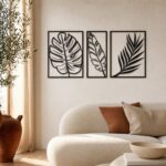 Tropical Leaf Trio Metal Wall Art in a living space